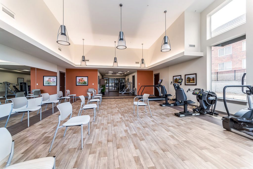 Fitness center with chairs and work out equipment